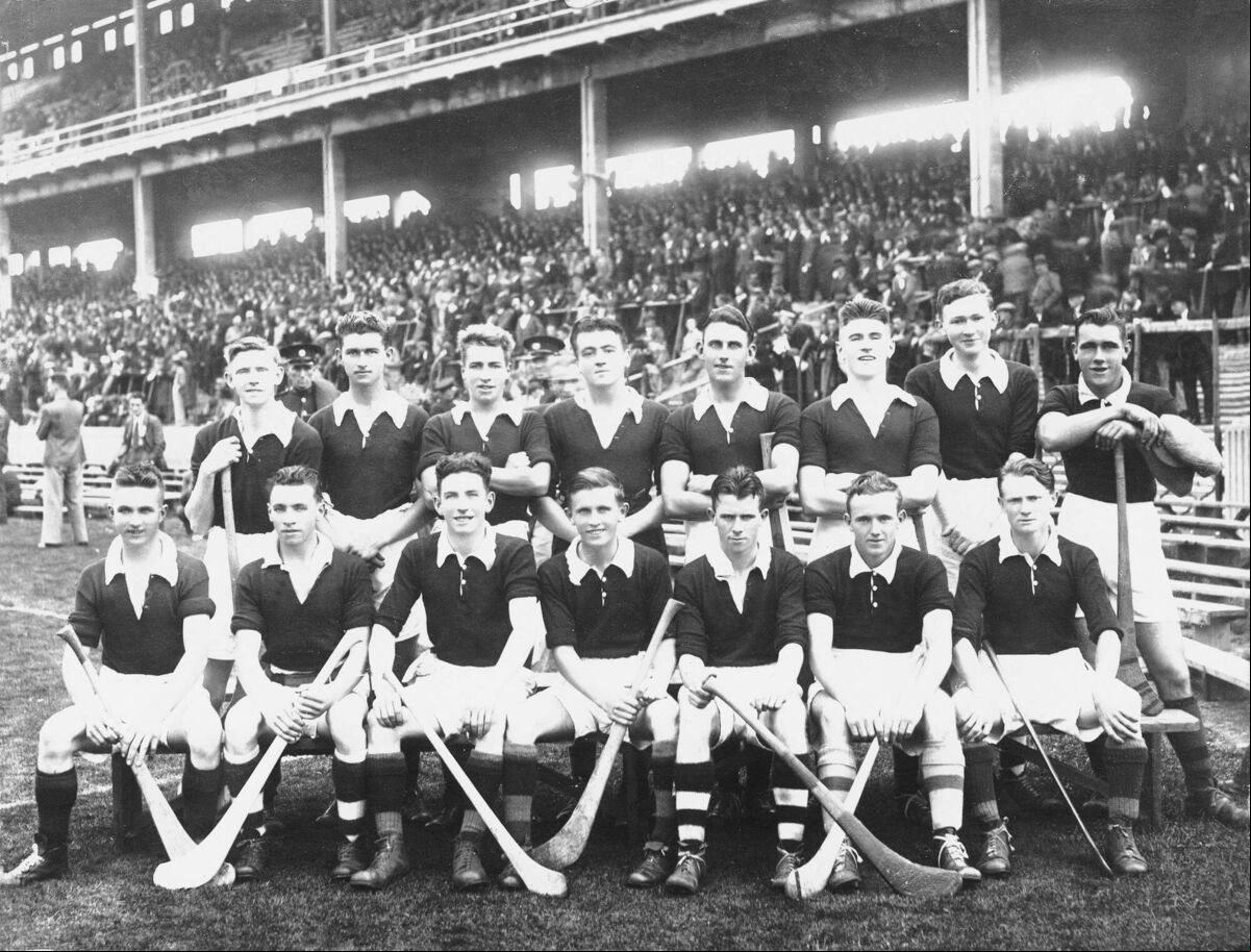The 1938 Cork minor hurling team. Back: Tadhg Ryan; Ted Foley; Eamonn Young; George Sadlier; Alan Lotty; Paddy Hogan; Luke O’Sullivan; Ted O’Sullivan. Front: Christy Ring; Killian O’Keeffe; Jerry Looney; Kevin McGrath (c); Jerry O’Mahony; Willie Cummins; Paddy Joe Quinn.