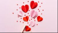 Valentine day composition with gift box and red hearts, photo template on pink background.