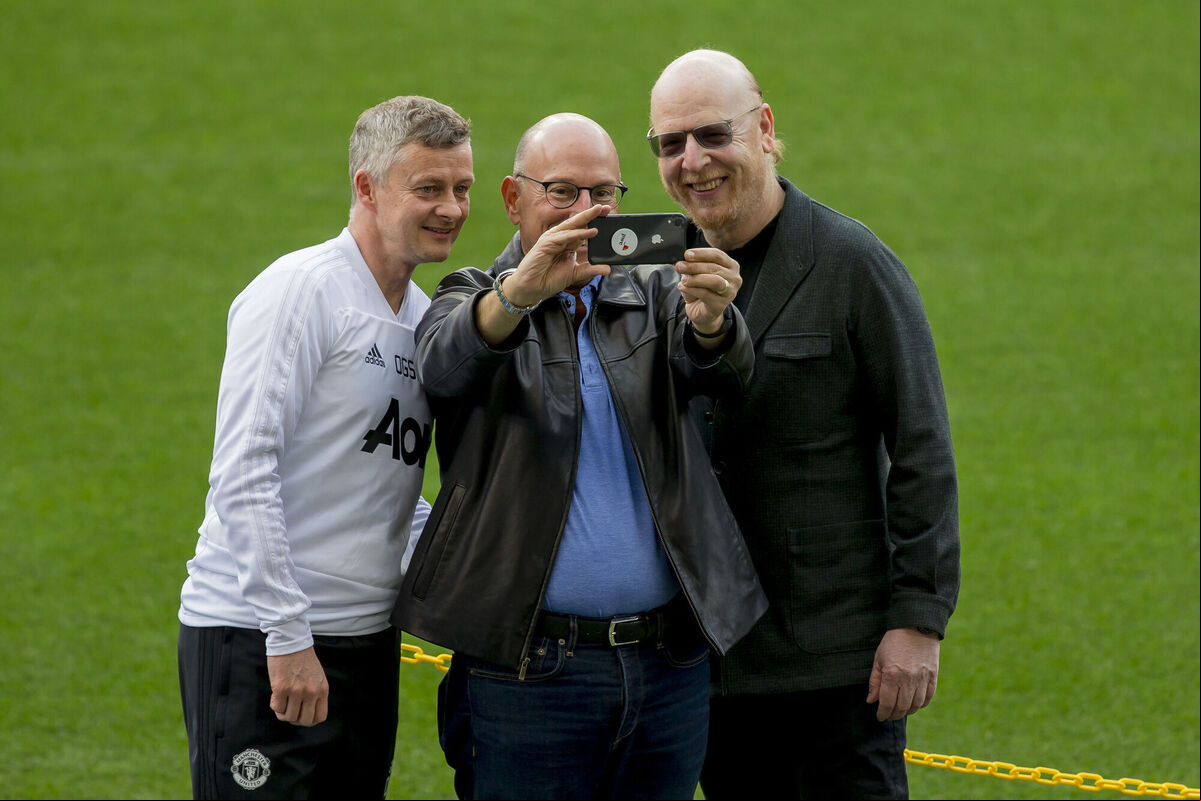 Manchester United's coach Ole Gunnar Solskjaer, left, takes a selfie with Manchester United owners Joel Glazer, centre, and Avram Glazer during the training session at the Camp Nou stadium in Barcelona, Spain, in  2019. Picture:AP Photo/Joan Monfort