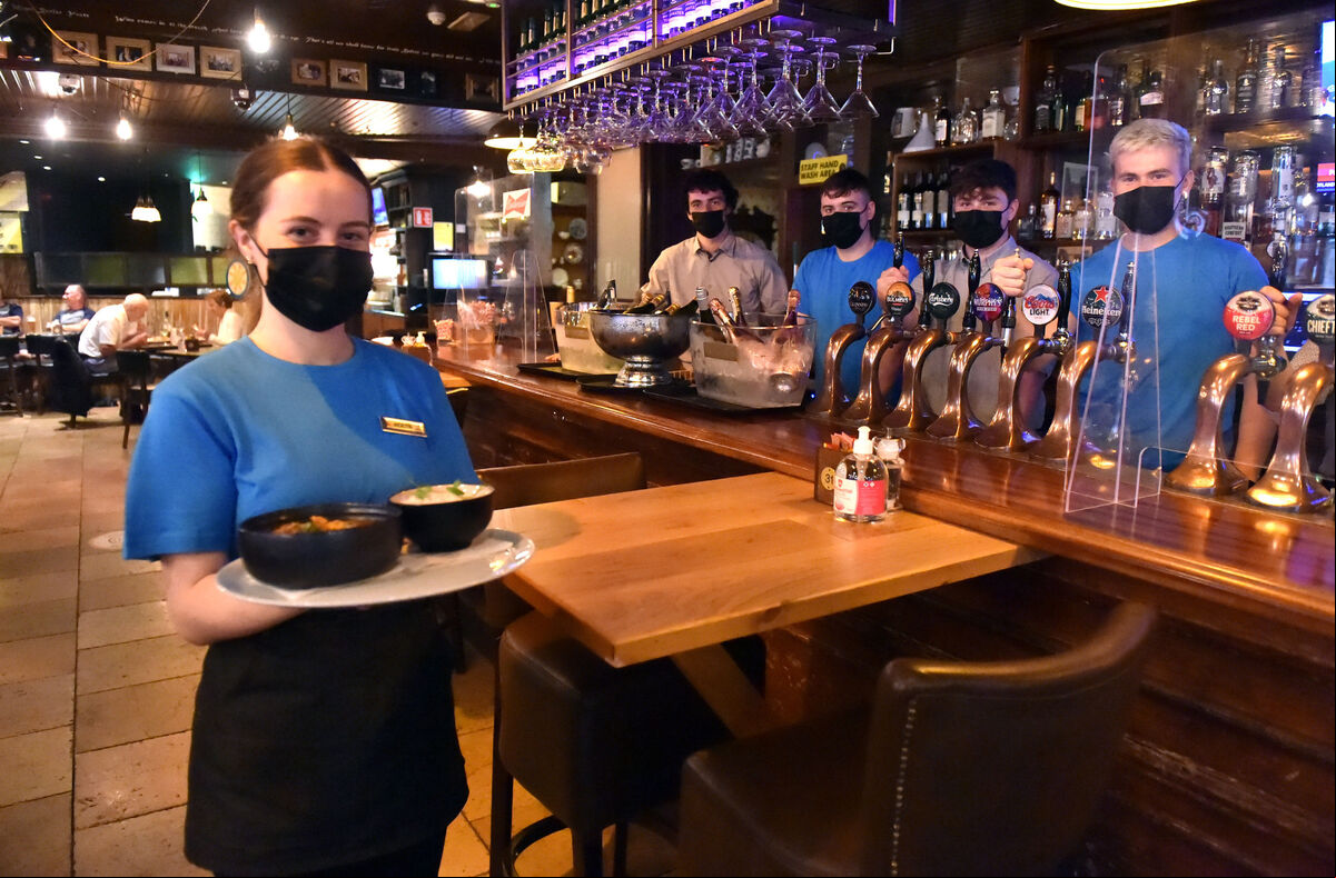 Aideen Mitchell and staff at the Oliver Plunkett bar as they resumed serving people indoors. Aideen Mitchell and staff at the Oliver Plunkett bar as they resumed serving people indoors.
