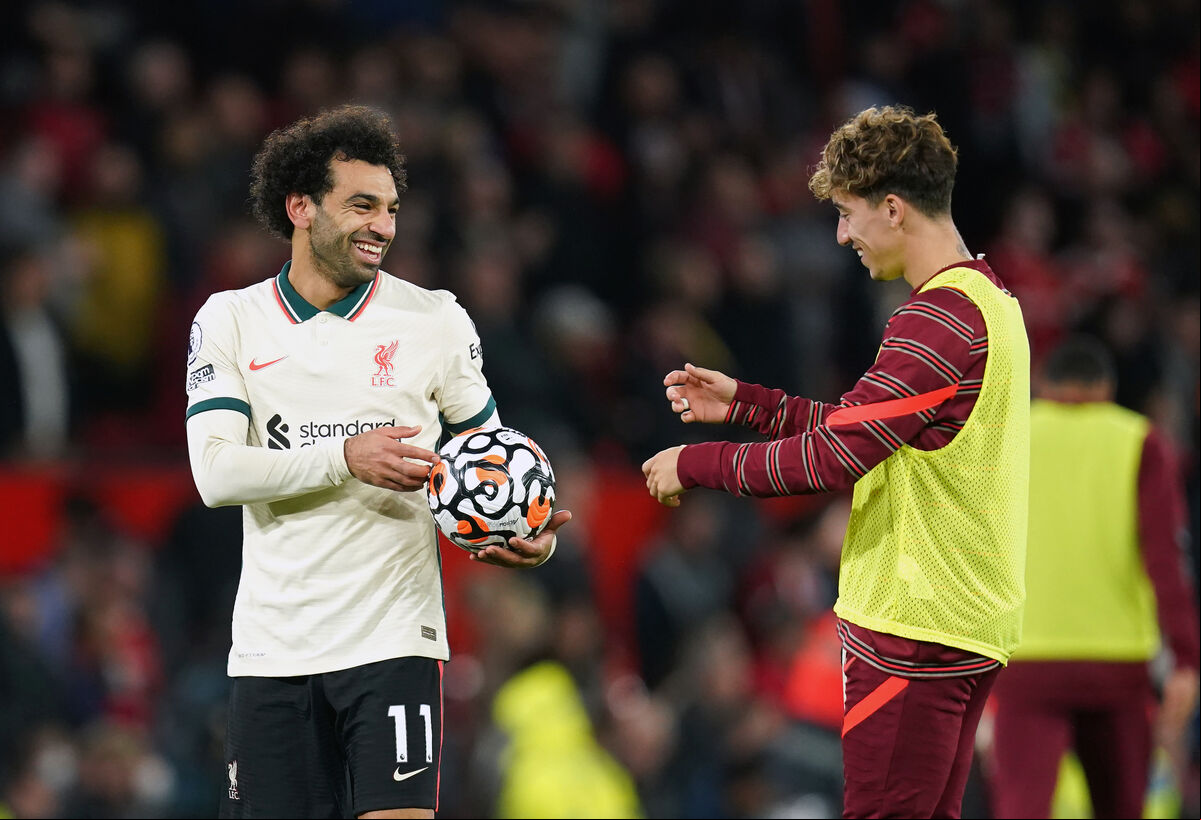Liverpool hat-trick scorer Mohamed Salah (left) celebrates with the match ball with Konstantinos Tsimikas after the final whistle at Old Trafford, Manchester. Liverpool hat-trick scorer Mohamed Salah (left) celebrates with the match ball with Konstantinos Tsimikas after the final whistle at Old Trafford, Manchester.
