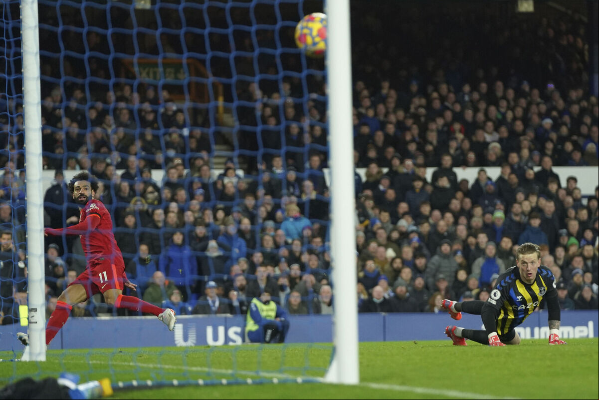 Liverpool's Mohamed Salah, left, scores past Everton's goalkeeper Jordan Pickford, for his side's second goal during their Premier League game at Goodison Park, Liverpool, on Wednesday. Picture: AP Photo/Jon Super Liverpool's Mohamed Salah, left, scores past Everton's goalkeeper Jordan Pickford, for his side's second goal during their Premier League game at Goodison Park, Liverpool, on Wednesday. Picture: AP Photo/Jon Super