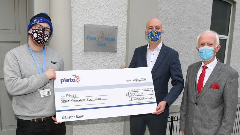 Businessman son of elderly advocate hands over charity cheque Businessman son of elderly advocate hands over charity cheque