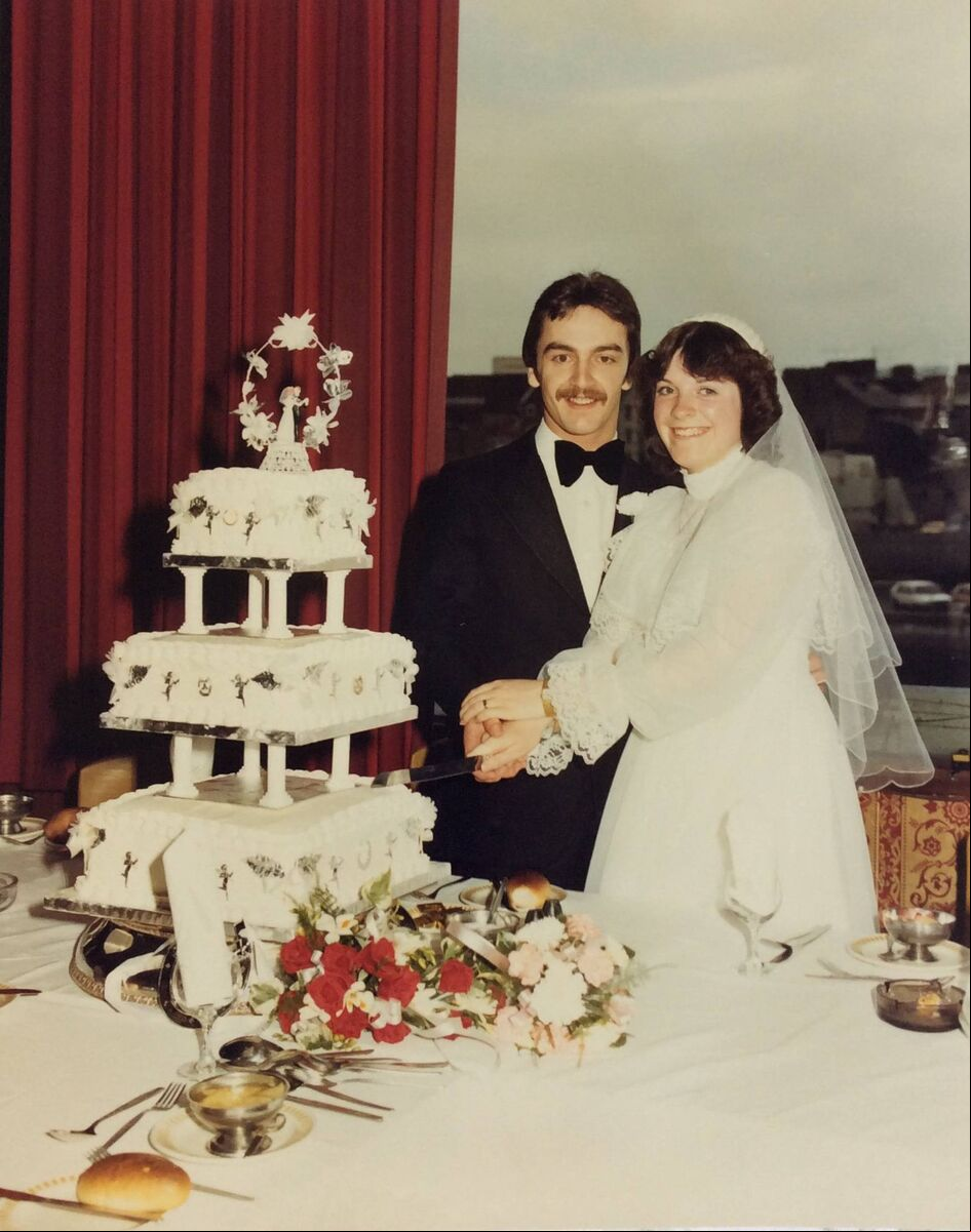 Michael and Ann Mulcahy, Frankfield cutting their wedding cake. Michael and Ann Mulcahy, Frankfield cutting their wedding cake.