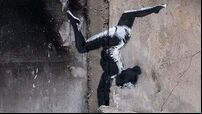 Banksy reveals artwork on side of damaged building in Ukraine