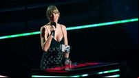 Taylor Swift praises fans as she collects top gong at 2022 MTV EMAs