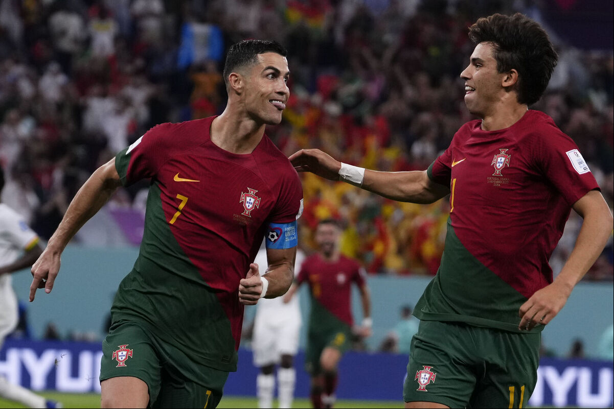 Portugal's Cristiano Ronaldo, left, celebrates with teammate Joao Felix after scoring from the penalty spot his side's opening goal against Ghana during a World Cup group H soccer match at the Stadium 974 in Doha, Qatar, on Thursday. Picture: AP Photo/Manu Fernandez Portugal's Cristiano Ronaldo, left, celebrates with teammate Joao Felix after scoring from the penalty spot his side's opening goal against Ghana during a World Cup group H soccer match at the Stadium 974 in Doha, Qatar, on Thursday. Picture: AP Photo/Manu Fernandez