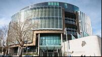 Man who brandished knives while robbing Centra jailed for four years