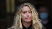 Amber Heard makes 'difficult decision' to end legal fight with Johnny Depp