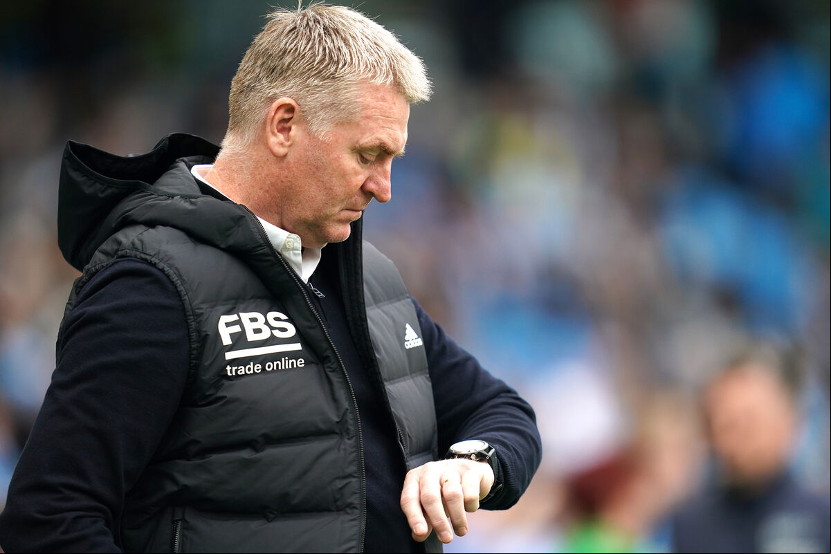 Leicester City manager Dean Smith looks at his watch before the Premier League match at the Etihad Stadium, Manchester. Leicester City manager Dean Smith looks at his watch before the Premier League match at the Etihad Stadium, Manchester.