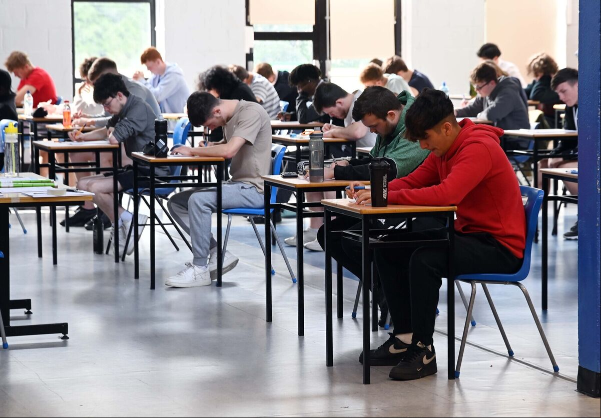 Leaving certificate students filling in their exam number on the answer booklet before receiving their first exam paper at Douglas Community School, Cork. Picture Denis Minihane. Leaving certificate students filling in their exam number on the answer booklet before receiving their first exam paper at Douglas Community School, Cork. Picture Denis Minihane.