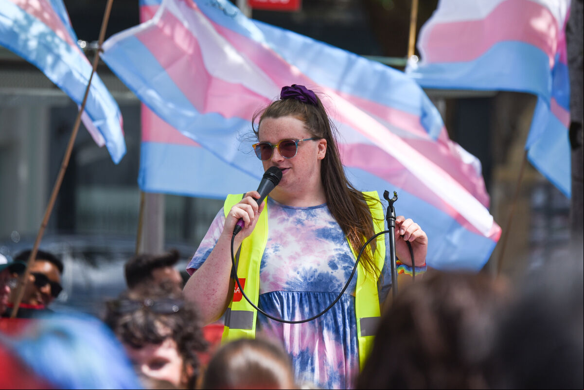 Saoirse Mackin, organiser of the Trans+ Pride Cork march, speaks to those in attendance on Saturday. Picture: Cian O'Regan. Saoirse Mackin, organiser of the Trans+ Pride Cork march, speaks to those in attendance on Saturday. Picture: Cian O'Regan.