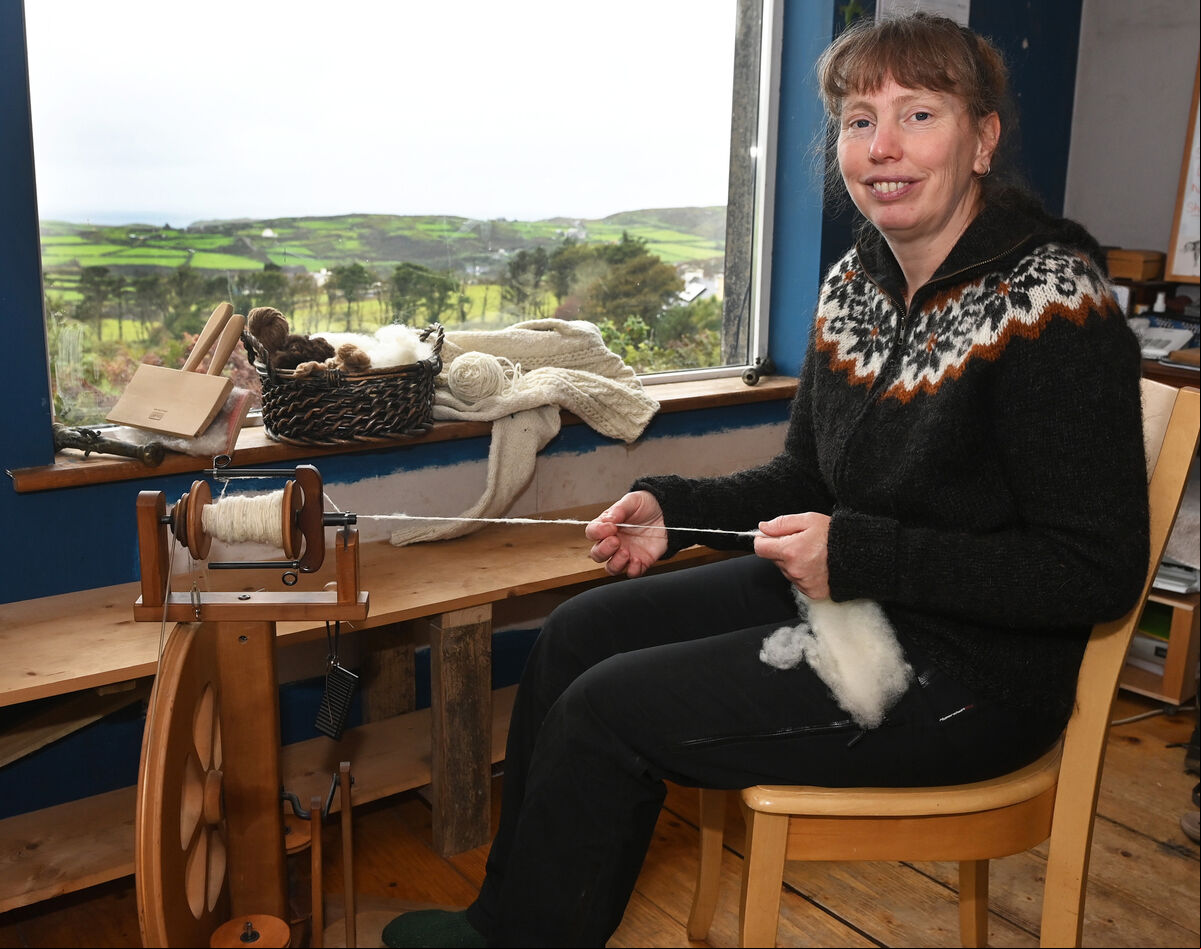 Kirsty Affleck, spinning wool from her sheep at home in Cape Clear. Picture; Eddie O'Hare Kirsty Affleck, spinning wool from her sheep at home in Cape Clear. Picture; Eddie O'Hare