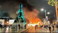 Dublin riots: Bus and Luas burnt, shops looted, as 400 gardaí face 'lunatic faction'