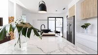 Kitchen marble bench close up with black hanging pendant