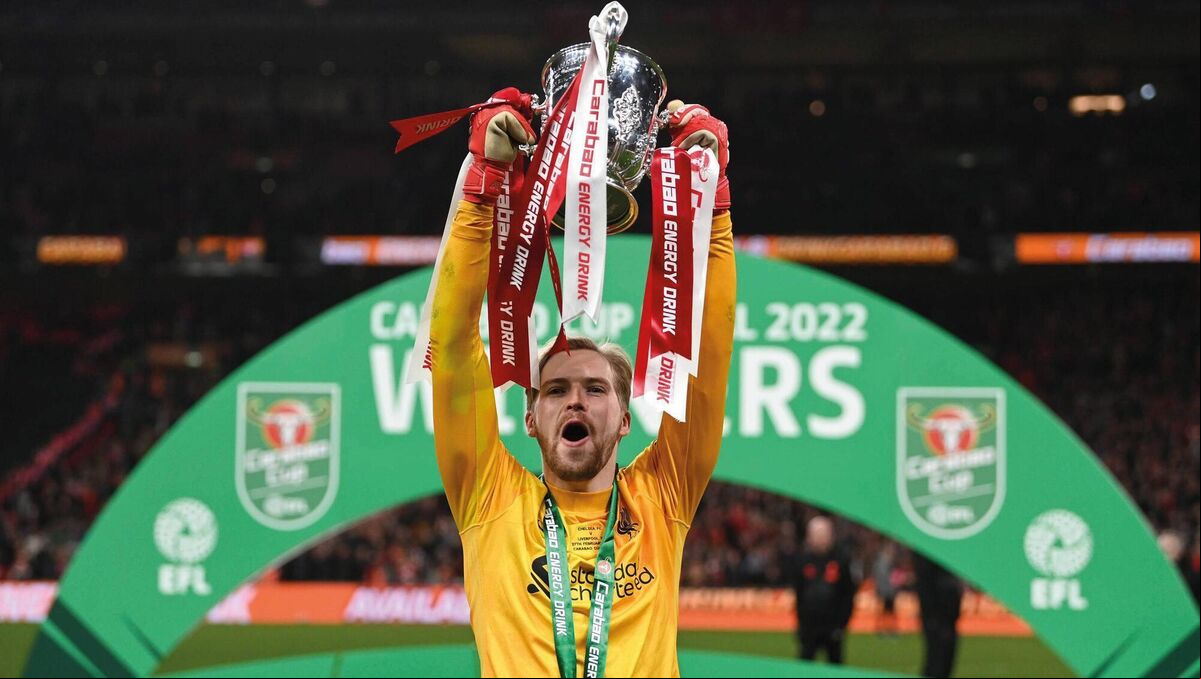 Caoimhín Kelleher of Liverpool lifts The Carabao Cup trophy following their side's victory during the Carabao Cup Final against Chelsea  at Wembley Stadium on February 27, 2022 in London, England. Picture: Shaun Botterill/Getty Images
