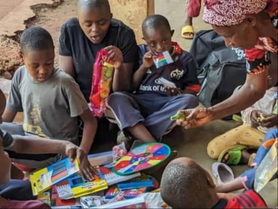 Children in Tanzania opening their gifts. Children in Tanzania opening their gifts.