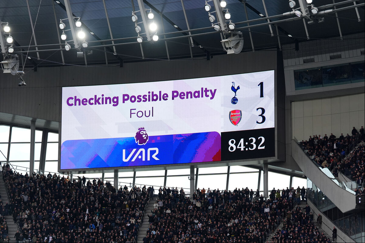 Fans await a VAR review before awarding Tottenham Hotspur a penalty during the Premier League match against Arsenal at the Tottenham Hotspur Stadium, London. Fans await a VAR review before awarding Tottenham Hotspur a penalty during the Premier League match against Arsenal at the Tottenham Hotspur Stadium, London.