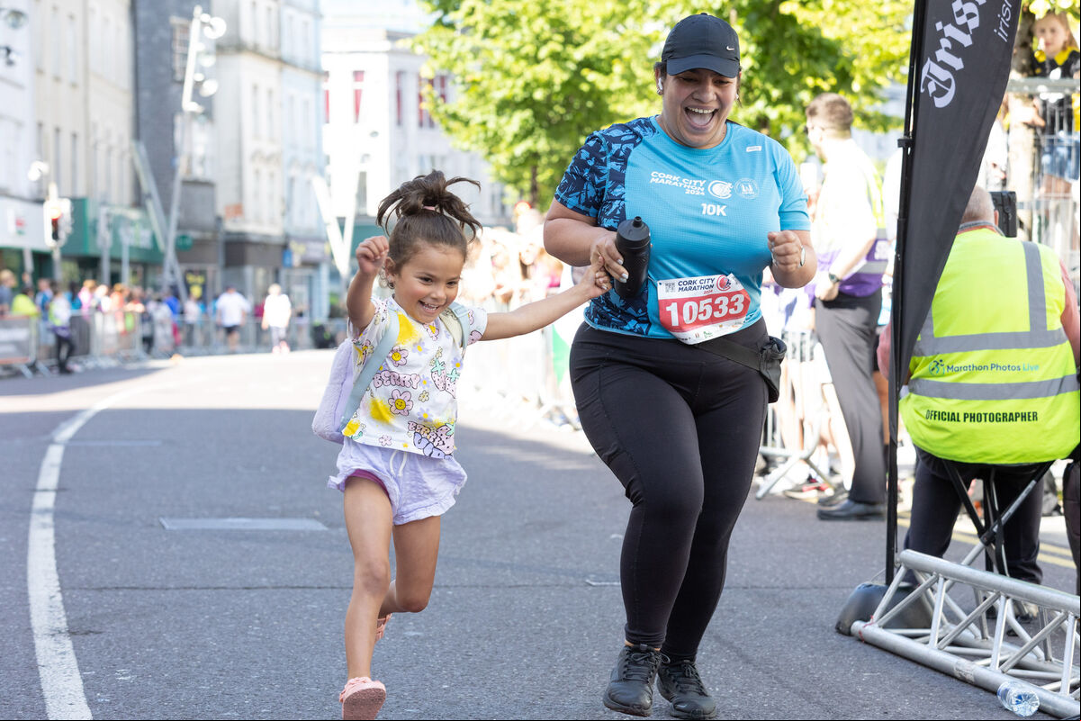 Gaby Patino from Carrigaline crossing the finish line of the 10K with her daughter Meghan Martinez, Carrigaline at the Cork City Marathon. Gaby Patino from Carrigaline crossing the finish line of the 10K with her daughter Meghan Martinez, Carrigaline at the Cork City Marathon.