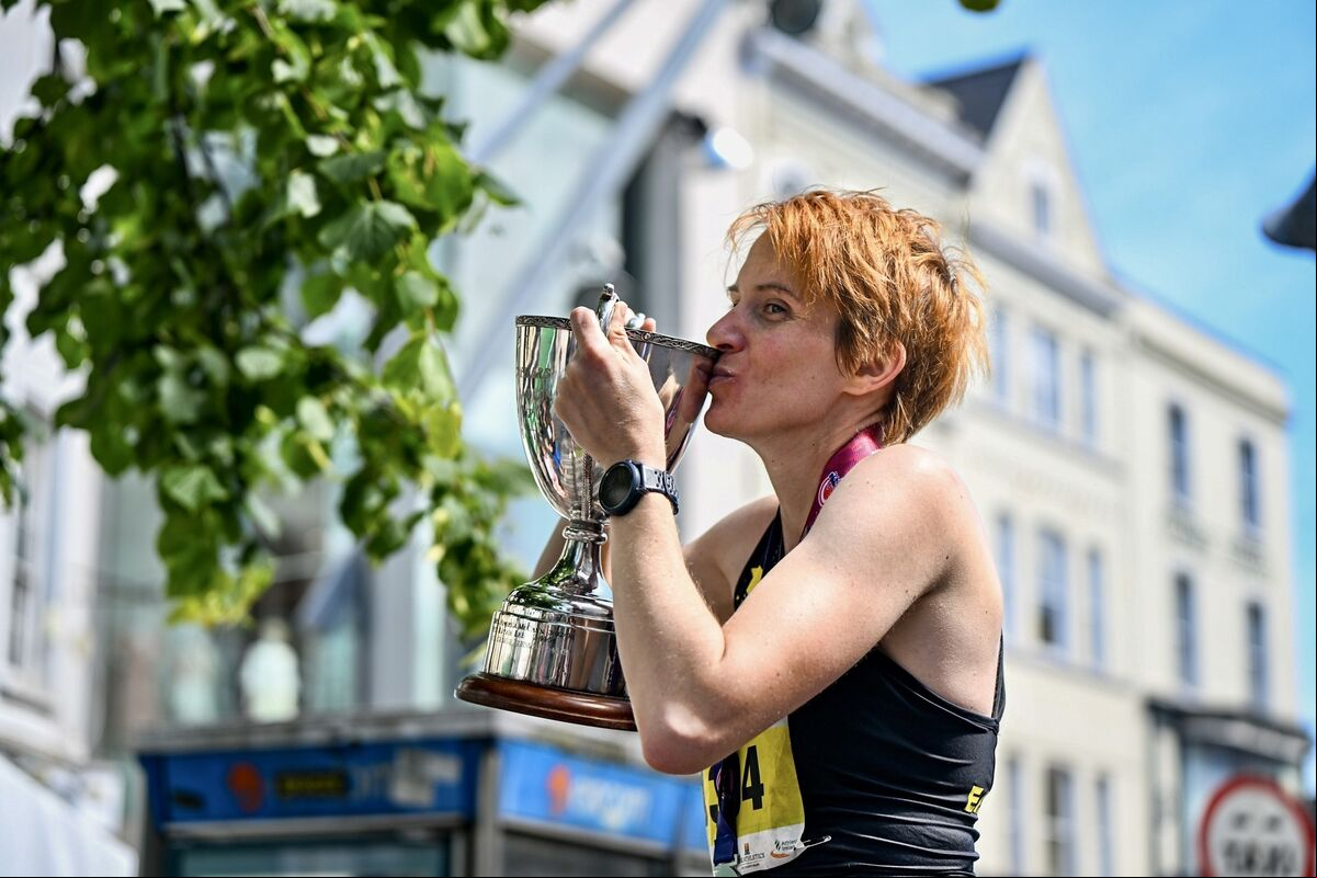 Aoife Cooke, winner of the women’s category in the 2024 Cork City Marathon kisses the trophy in delight. Picture: Chani Anderson Aoife Cooke, winner of the women’s category in the 2024 Cork City Marathon kisses the trophy in delight. Picture: Chani Anderson