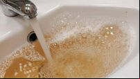 Discoloured water protest at offices of Uisce Éireann