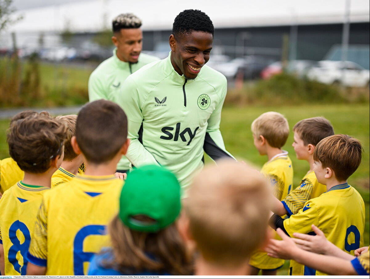 Ireland's Chiedozie Ogbene is welcomed by Manortown FC players to their training session at the FAI National Training Centre in Abbotstown, Dublin. Picture: Stephen McCarthy/Sportsfile Ireland's Chiedozie Ogbene is welcomed by Manortown FC players to their training session at the FAI National Training Centre in Abbotstown, Dublin. Picture: Stephen McCarthy/Sportsfile