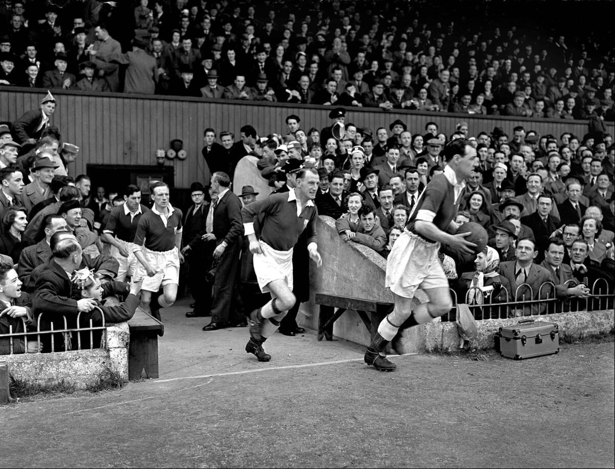 Cork Athletic captain Florrie Burke, followed by Paddy O'Leary, Willie Cotter and Jackie Lennox leads his team out against Dundalk in the 1952 FAI Cup final at Dalymount Park, Dublin. This was the team's third year in a row to reach the final. Cork Athletic captain Florrie Burke, followed by Paddy O'Leary, Willie Cotter and Jackie Lennox leads his team out against Dundalk in the 1952 FAI Cup final at Dalymount Park, Dublin. This was the team's third year in a row to reach the final.
