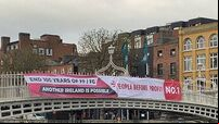 Ha'penny Bridge banner calls for end to 100 years of Fine Gael and Fianna Fáil