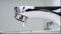 Drop of water falling from faucet.