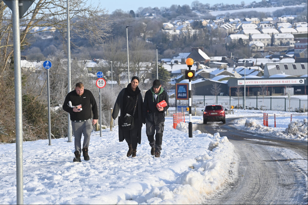 Making their way home in the snow from the shops were Jamie O'Keffe, Claire Murphy and Barry O'Leary in Kanturk, Co Cork. Picture Dan Linehan Making their way home in the snow from the shops were Jamie O'Keffe, Claire Murphy and Barry O'Leary in Kanturk, Co Cork. Picture Dan Linehan