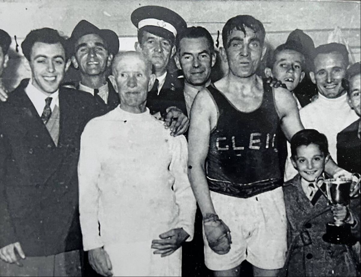 Paddy ‘the Champ’ Martin, immediately after his victory over Joe Bygraves in Cork City Hall on Friday night, January 12, 1951. Beside him is his young nephew, John Sheehan. Picture courtesy of John Sheehan. Paddy ‘the Champ’ Martin, immediately after his victory over Joe Bygraves in Cork City Hall on Friday night, January 12, 1951. Beside him is his young nephew, John Sheehan. Picture courtesy of John Sheehan.
