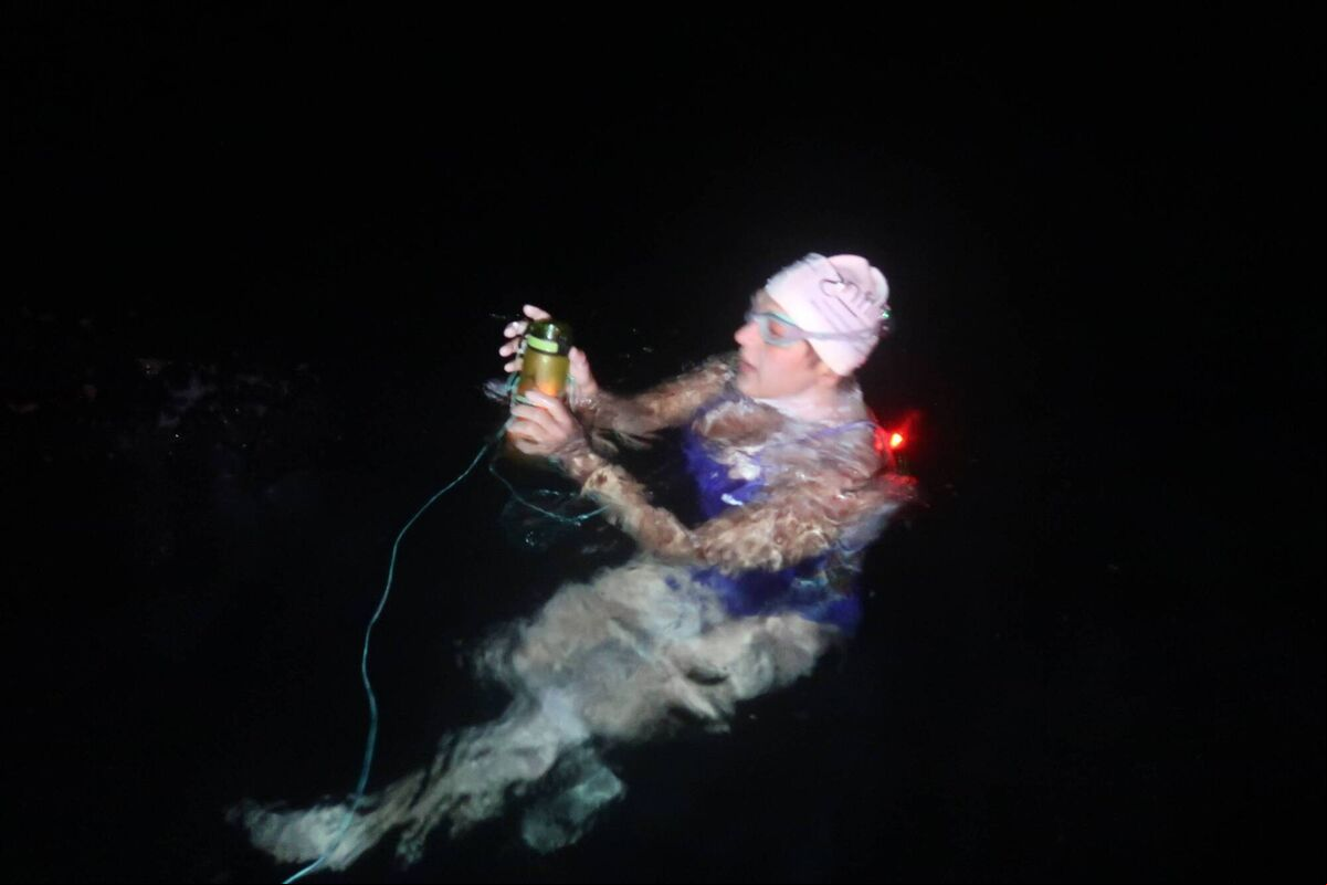 Olga O'Sullivan feeding herself in the dark during the Dal Riata Channel swim.