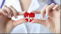 Doctor holds in his hands an icon with cardiogram of heart