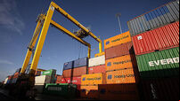 Shipping containers are seen stacked up