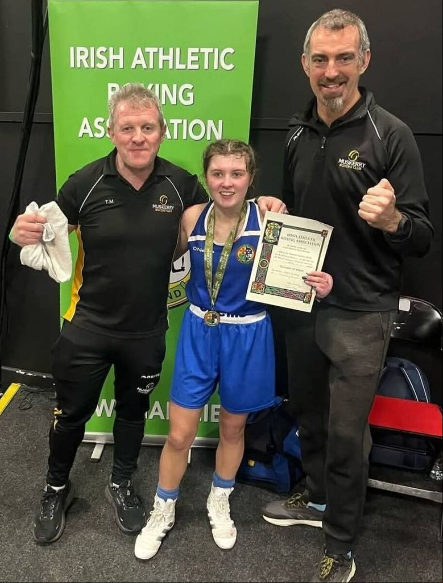 Muskerry Boxing Club celebrates another All-Ireland winner in Abby Murray, pictured with her father and coach Tom Murray and coach Mike McGrath JW 