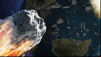 Burning asteroid moving through the Earth