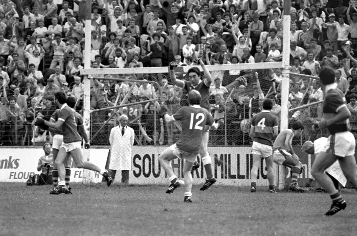 Cork v. Kerry in the Munster senior football final at Pairc Ui Chaoimh in 1983. Cork wing-forward Tadgh Murphy celebrates scoring his side's second goal with Dave Barry, while Kerry goalkeeper Charlie Nelligan disputes the decision with the umpire Cork v. Kerry in the Munster senior football final at Pairc Ui Chaoimh in 1983. Cork wing-forward Tadgh Murphy celebrates scoring his side's second goal with Dave Barry, while Kerry goalkeeper Charlie Nelligan disputes the decision with the umpire