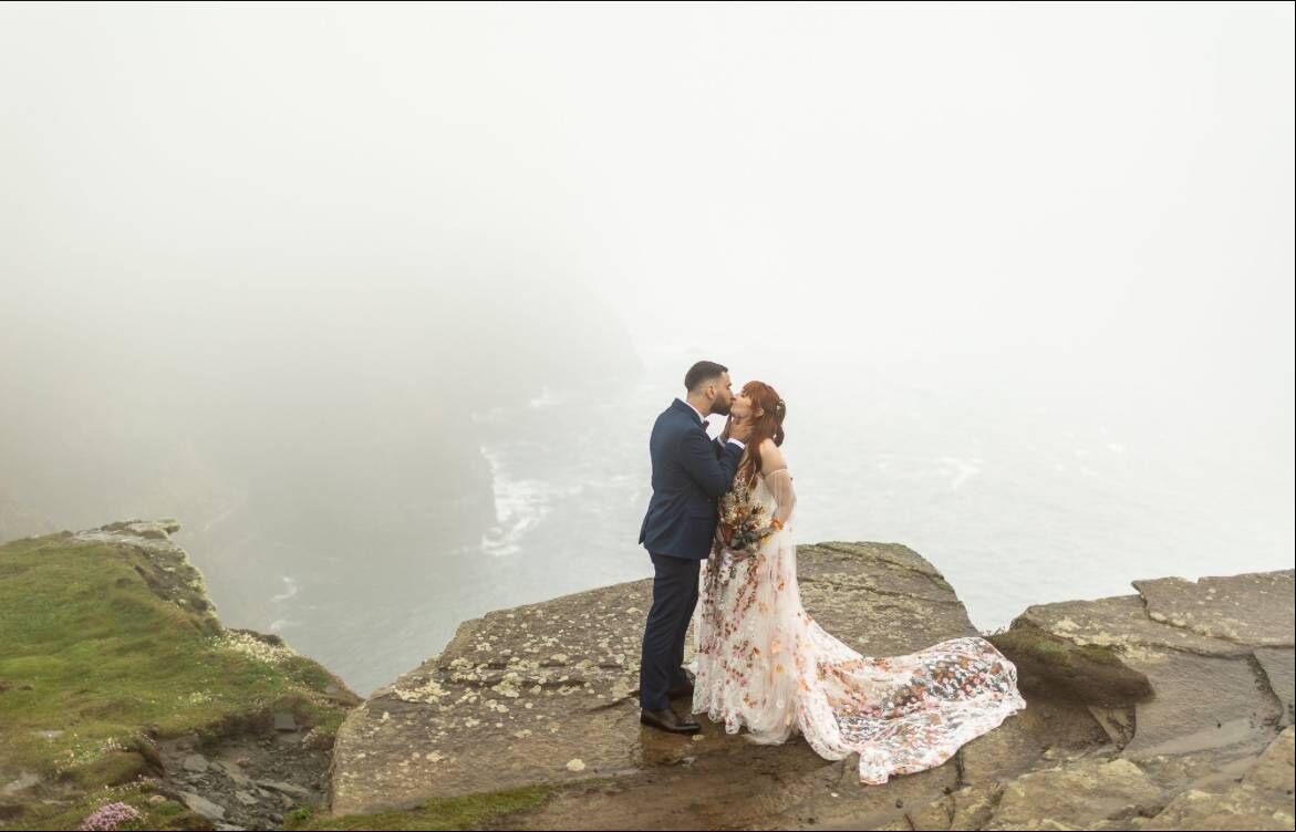 Danielle and George said that while they didn’t get a blue sky day for their pictures, the mist reminded them they can still have a laugh in the rain. Danielle and George said that while they didn’t get a blue sky day for their pictures, the mist reminded them they can still have a laugh in the rain.