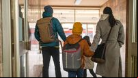 Happy family on train station