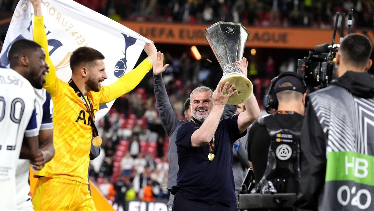 Tottenham Hotspur manager Ange Postecoglou celebrates with the trophy in front of the fans after the final whistle in the UEFA Europa League final at the Estadio de San Mames in Bilbao, Spain. Picture: Nick Potts/PA Wire