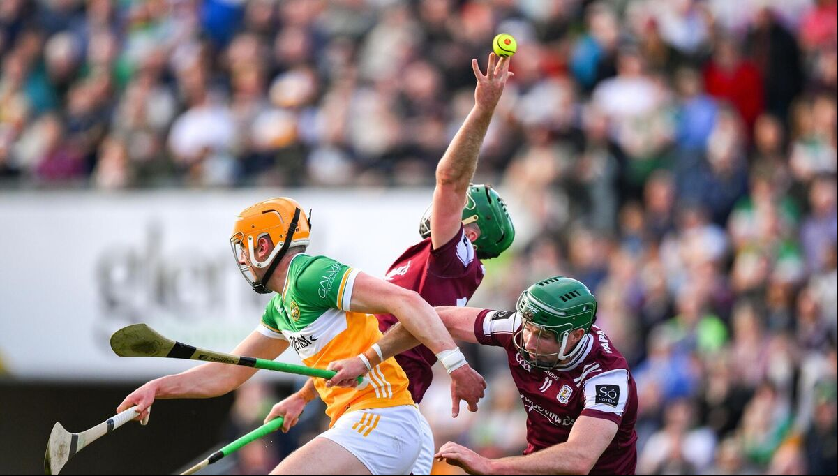 Ciaran Burke of Offaly, Brian Concannon, and Cathal Mannion of Galway try to catch the sliotar. Picture: Ray McManus/Sportsfile