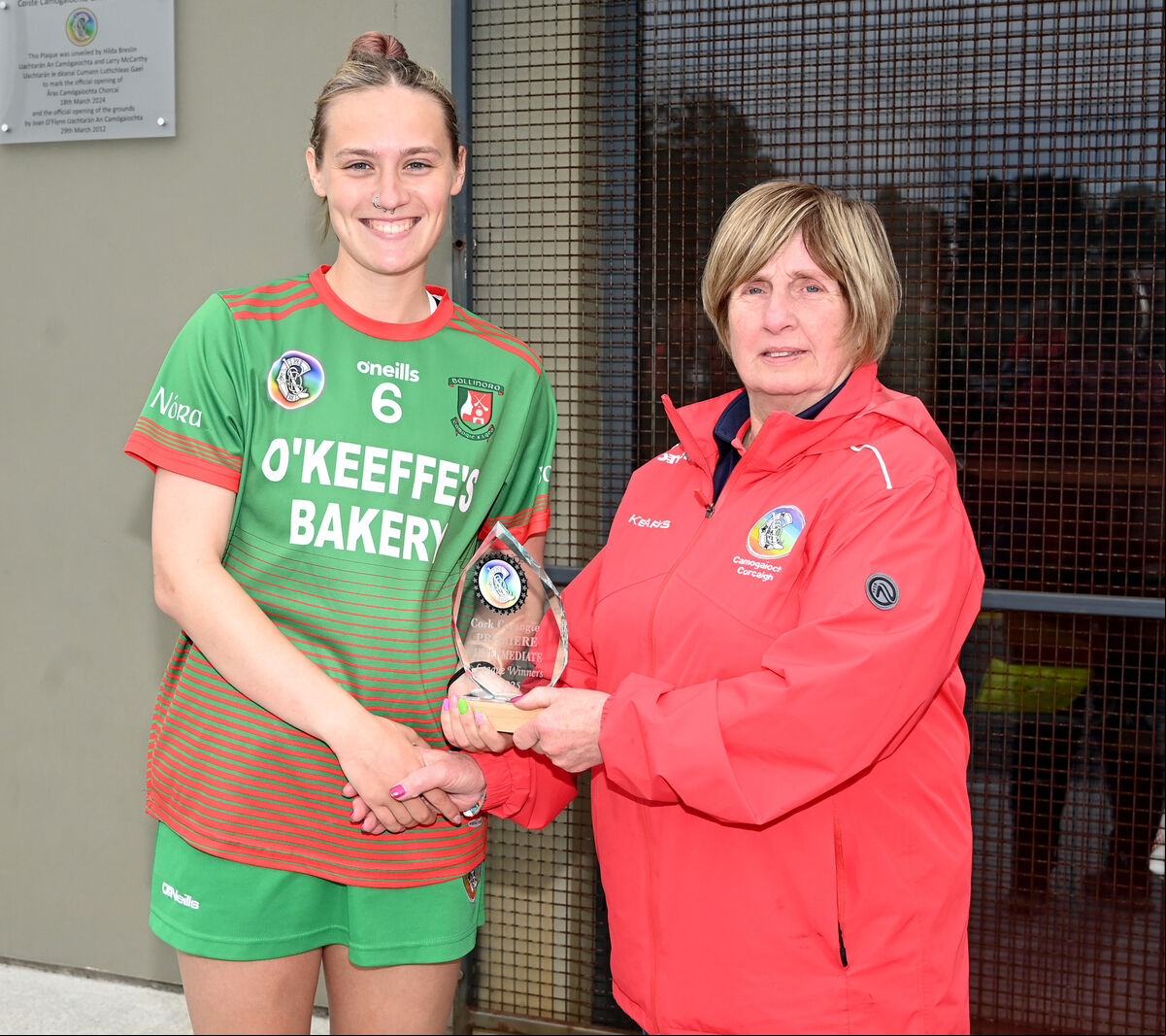 Mary McSweeney presents the trophy to Ballinora captain Sarah O'Keeffe. Picture: Eddie O'Hare Mary McSweeney presents the trophy to Ballinora captain Sarah O'Keeffe. Picture: Eddie O'Hare