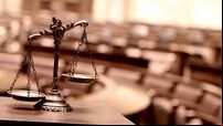 Symbol of law and justice in the empty courtroom