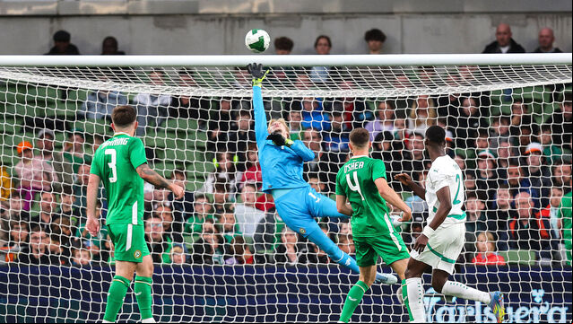 <p>Ireland goalkeeper Caoimhín Kelleher makes a fingertip save from the header of Abdallah Sima of Senegal. Picture: INPHO/Bryan Keane</p>