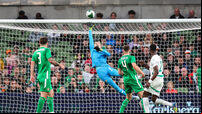Caoimhin Kelleher makes a fingertip save from the header of Abdallah Sima 6/6/2025