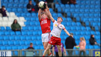 Cathal Farely challenges Niall O'Callaghan for a high ball 7/6/2025