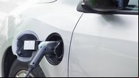 Electric car plugged in charging
